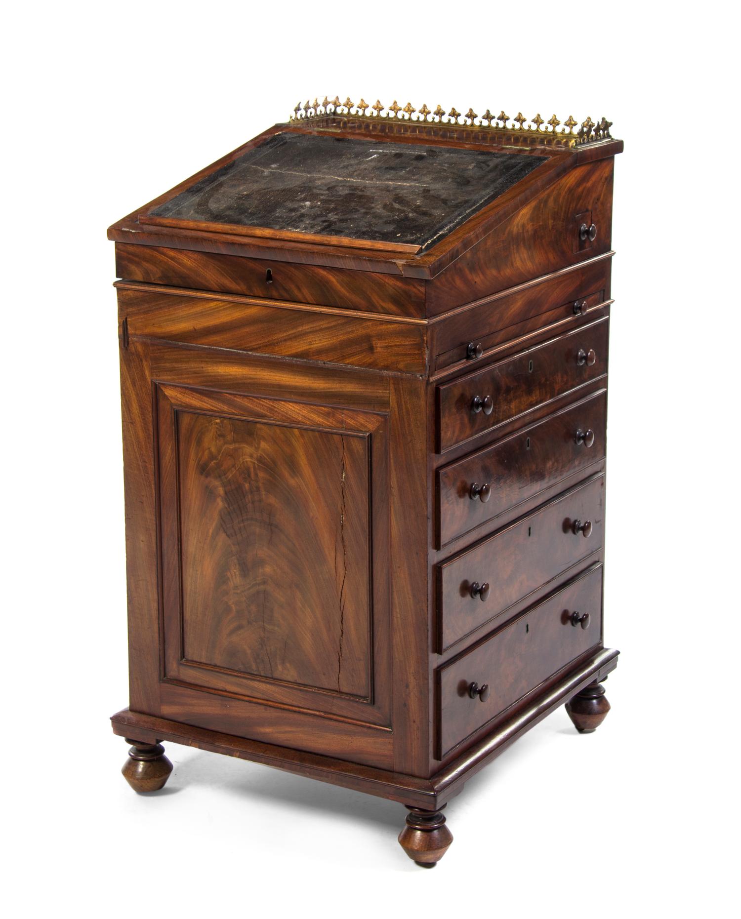 An English Mahogany Davenport Desk, Height 37 x width 19 5/8 x depth 21 7/8 inches.