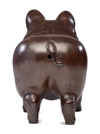 A Glazed Sewer Tile Advertising Pig
