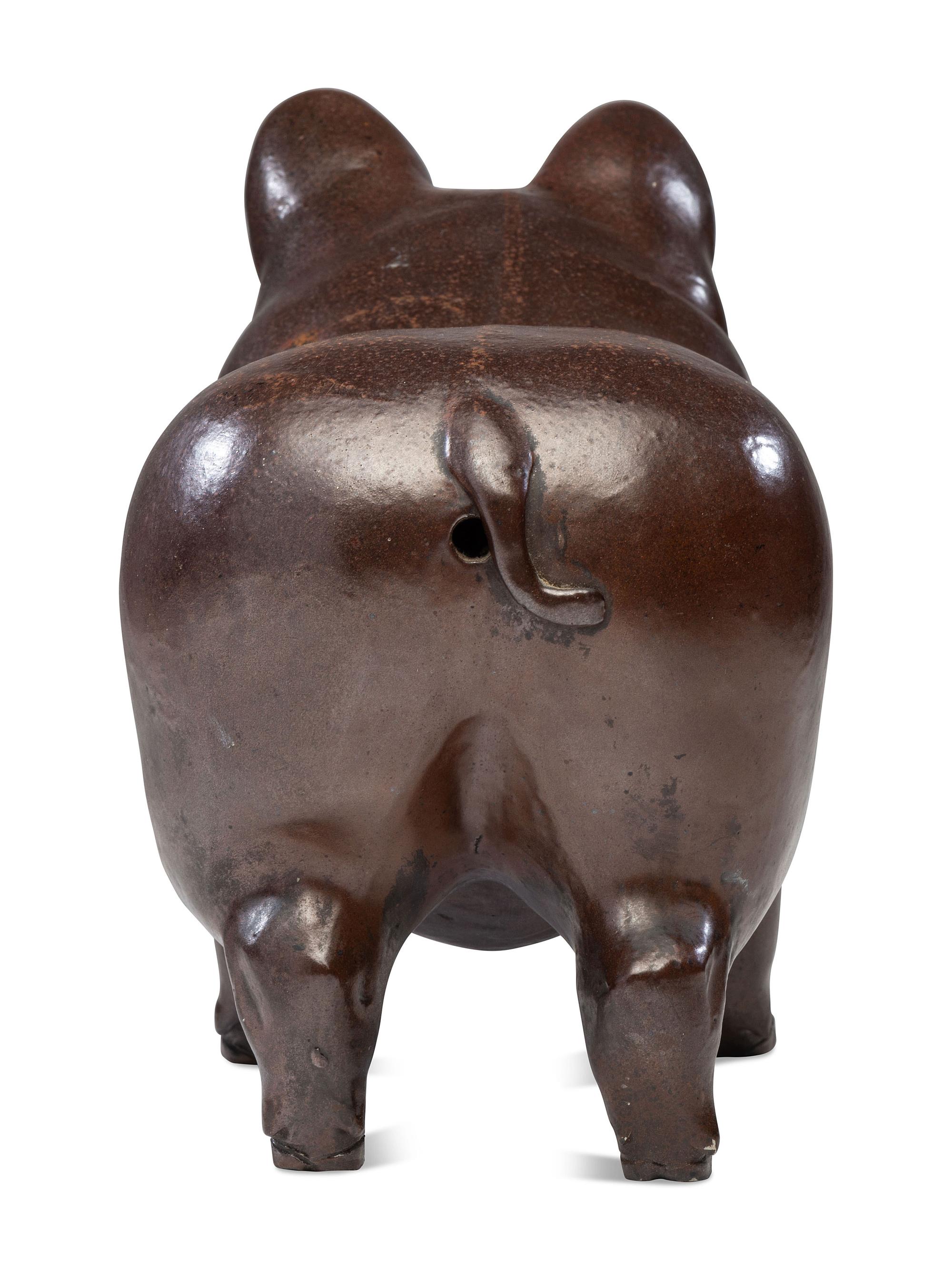 A Glazed Sewer Tile Advertising Pig