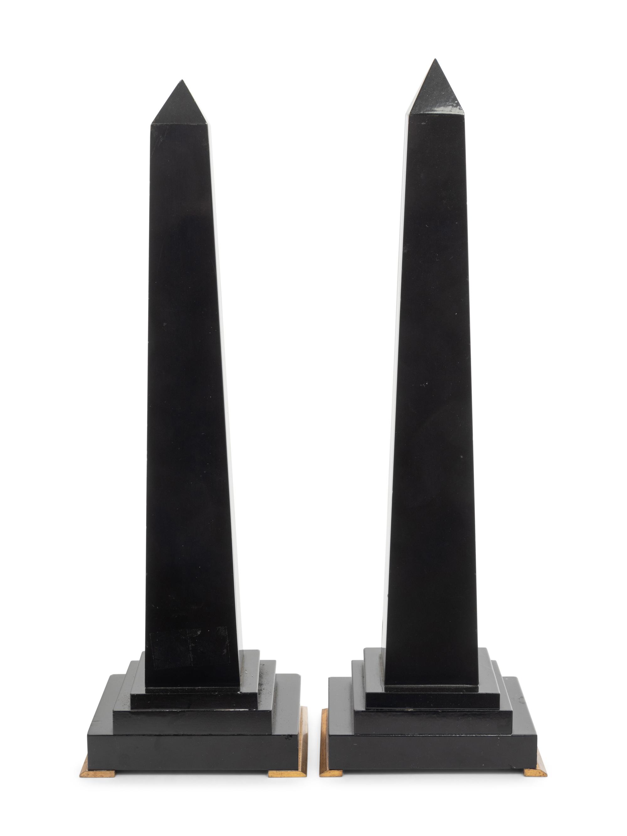 A Pair of Black Marble Obelisks