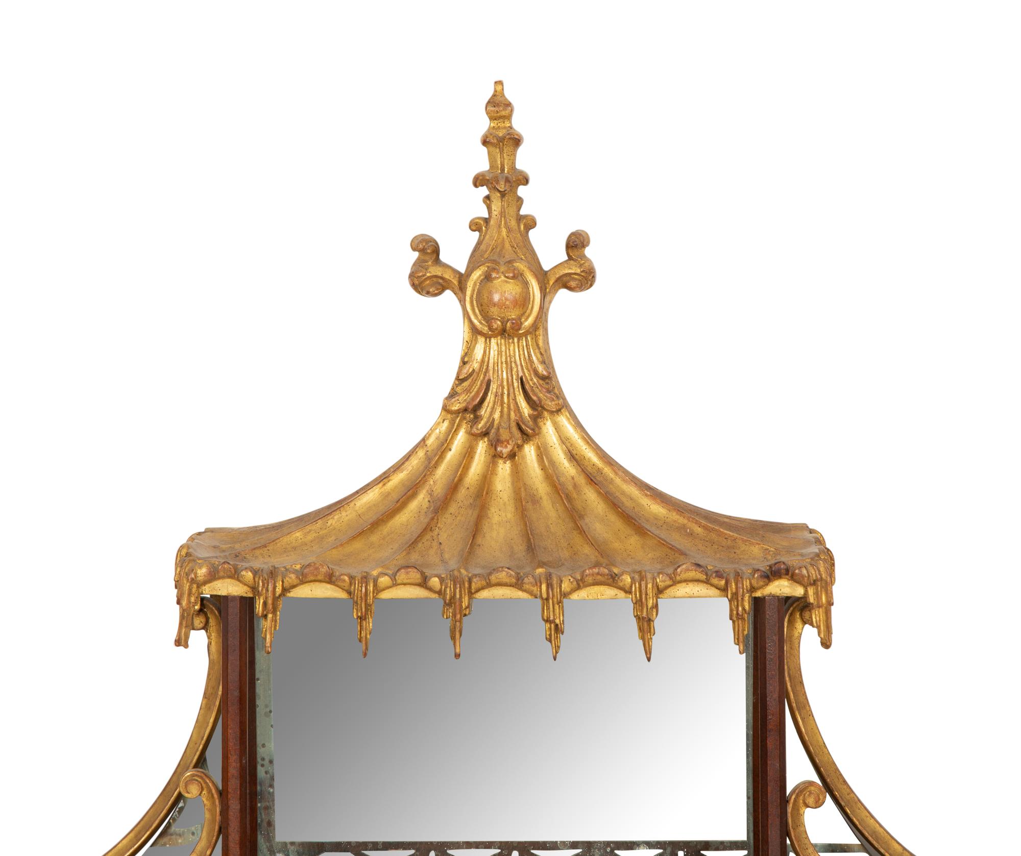 A George III Style Pierce Carved and Parcel Gilt Mahogany and Mirror Glass Pagoda-Form Hanging Étagère