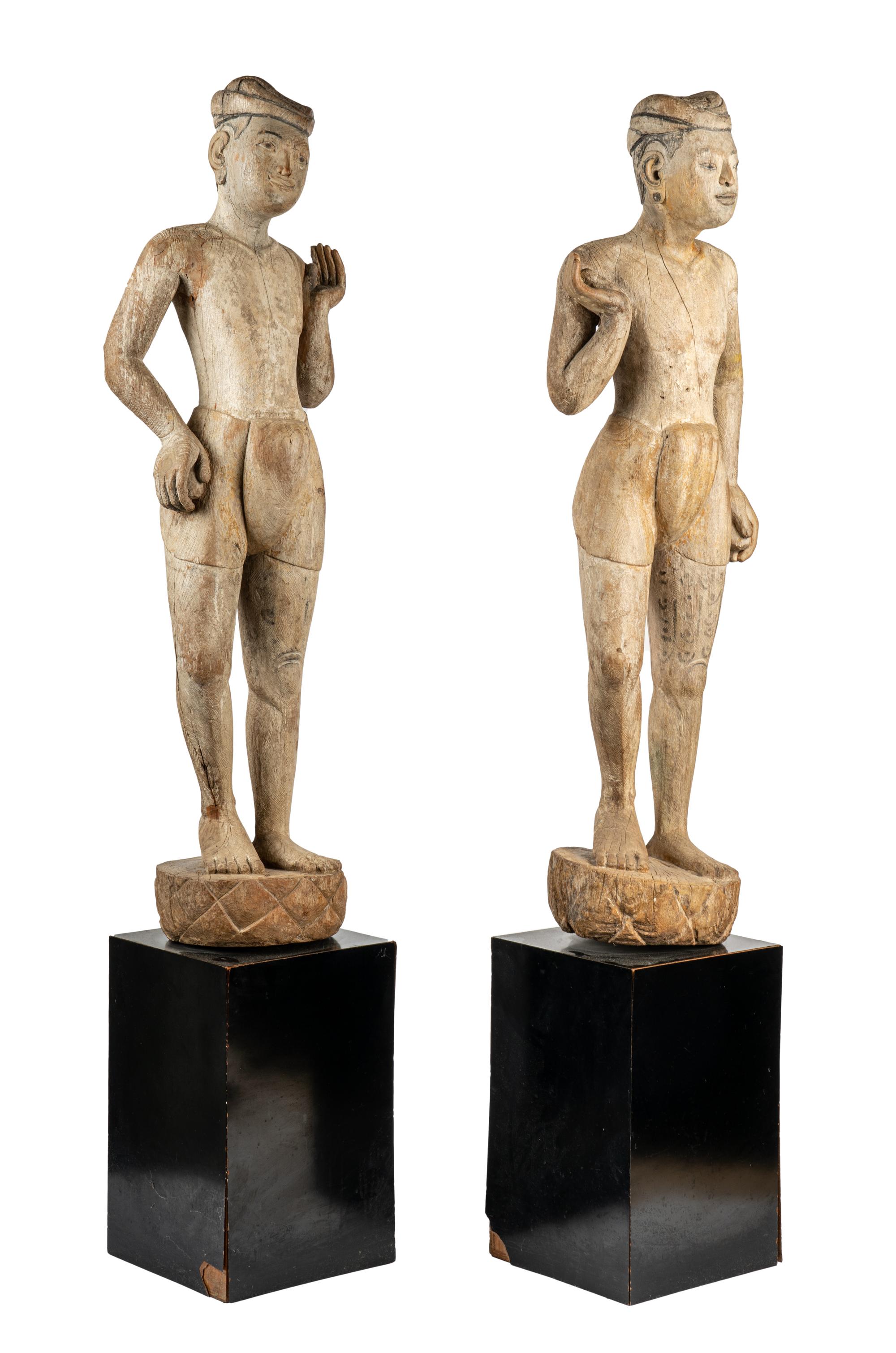 A Pair of Burmese Mandalay Carved and Painted Wood Figures