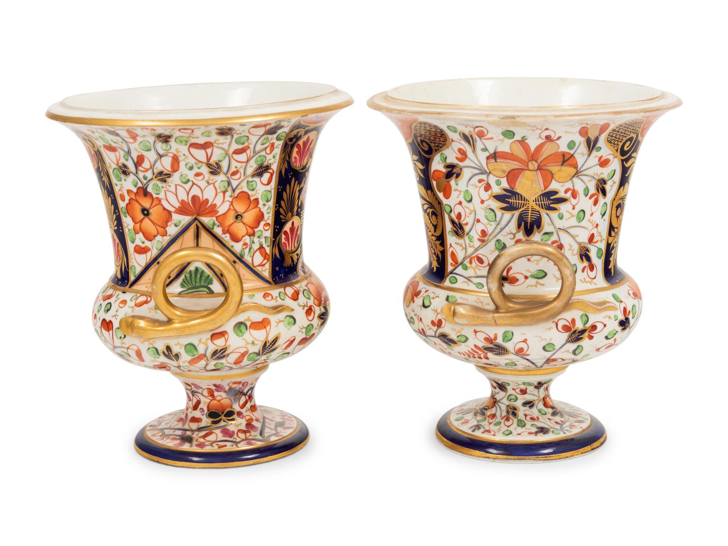 A Near Pair of Derby Porcelain Campagna Urns
