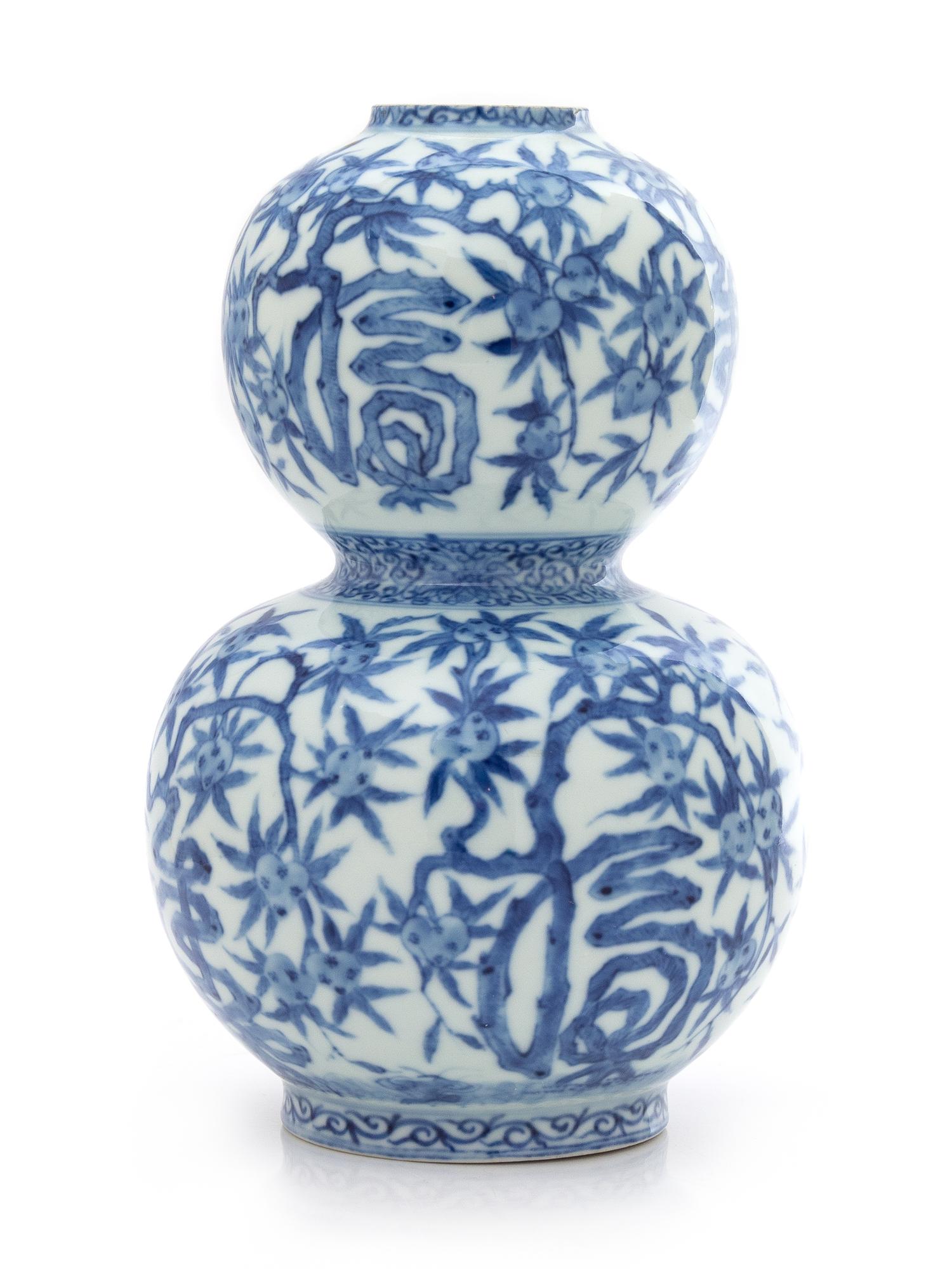 A Chinese Blue and White Gourd-Form Porcelain Vase