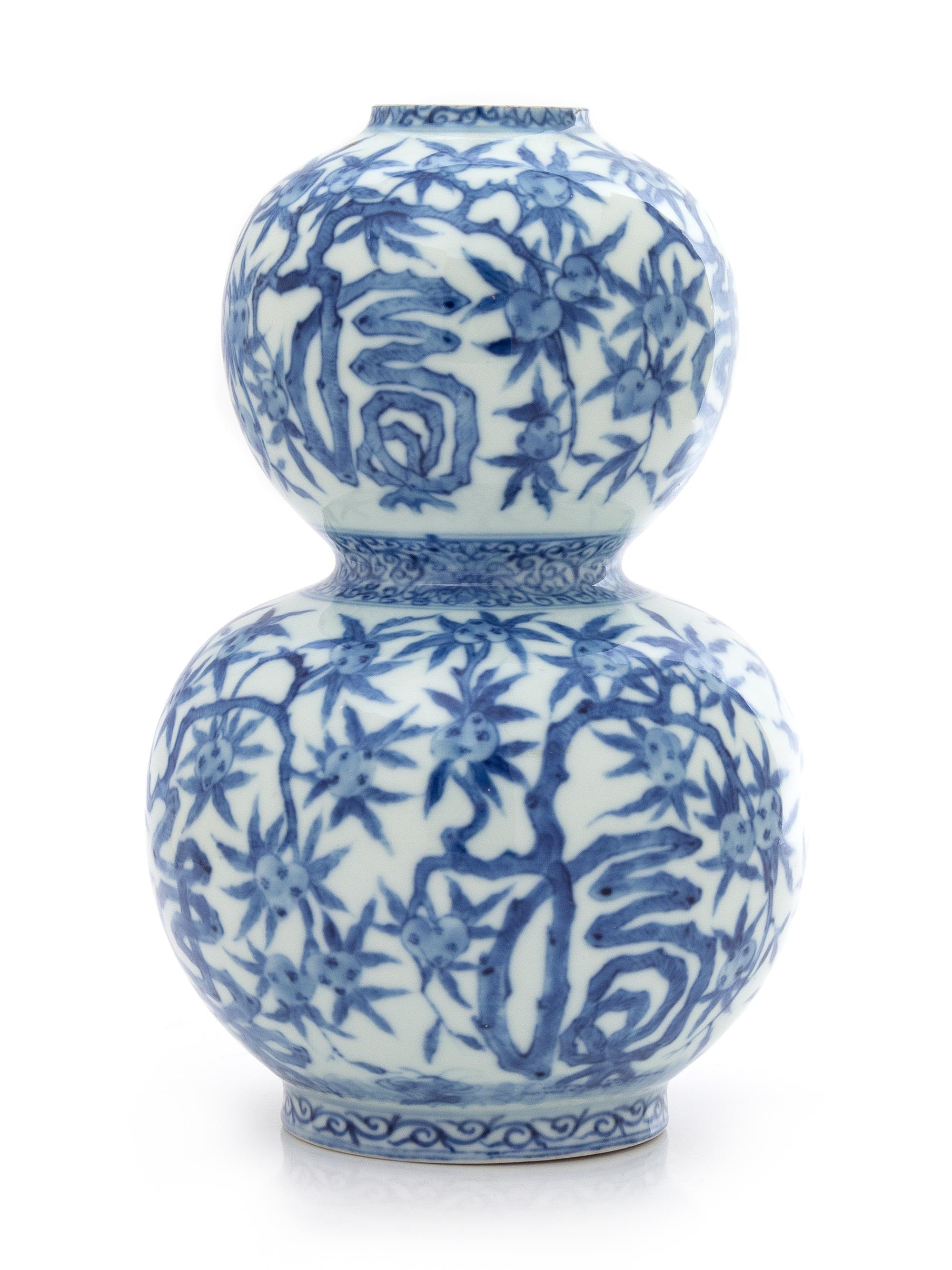 A Chinese Blue and White Gourd-Form Porcelain Vase