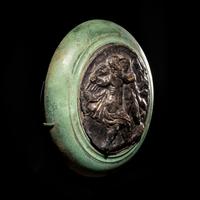 A Roman Silver and Bronze Boss with Erotes