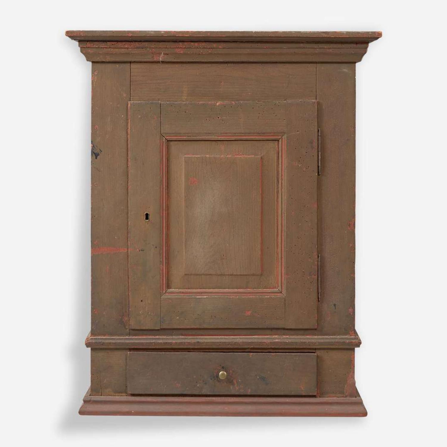 A green or brown painted pine wall cupboard late 18th century