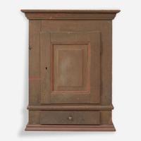 A green or brown painted pine wall cupboard late 18th century