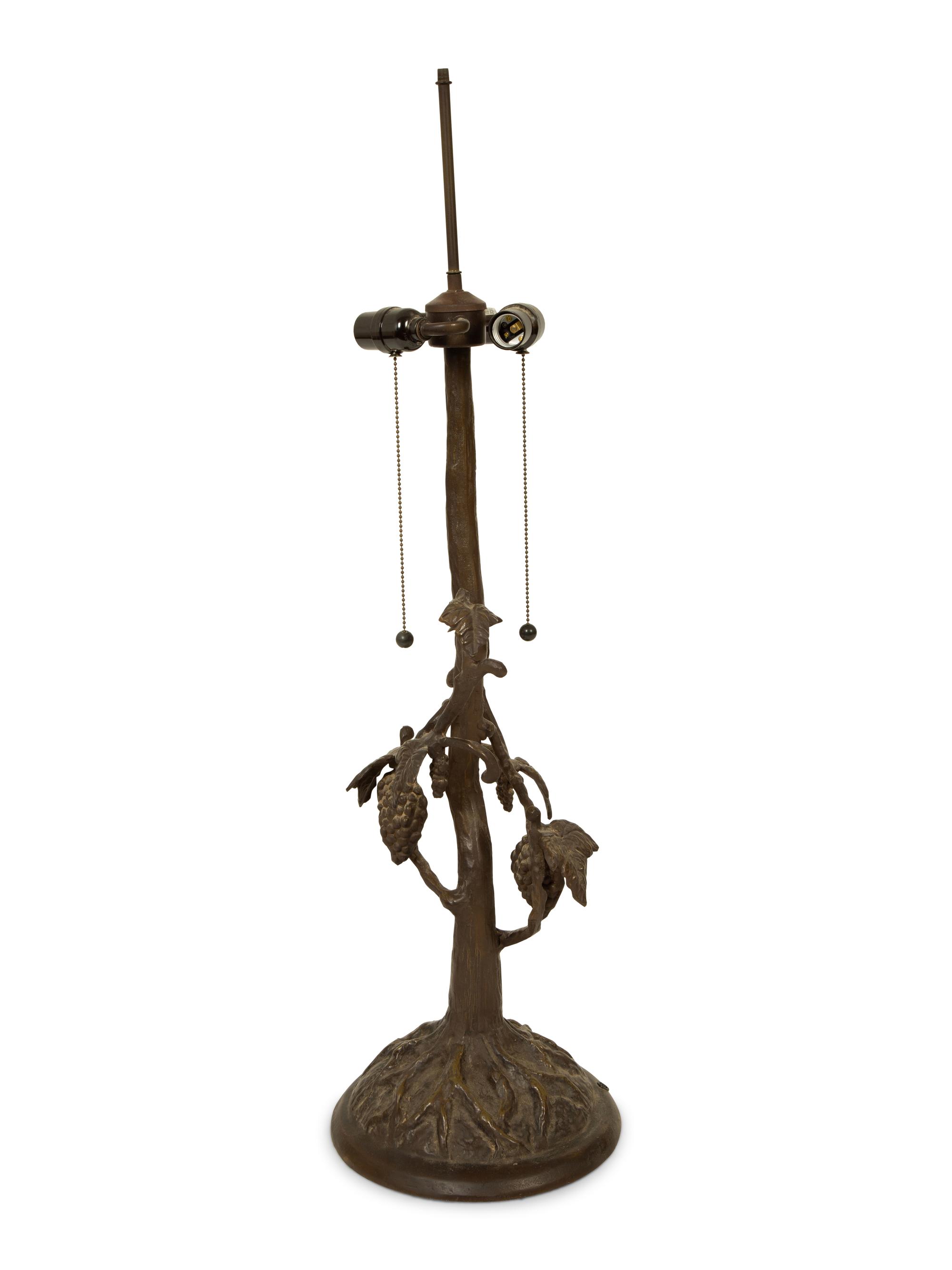 A Leaded Glass and Cast Metal Table Lamp