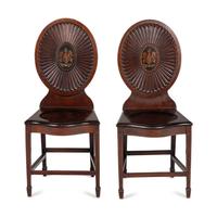 A Pair of Regency Style Mahogany and Polychrome Decorated Hall Chairs