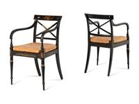 A Set of Twelve Regency Ebonized and Parcel Gilt Dining Chairs