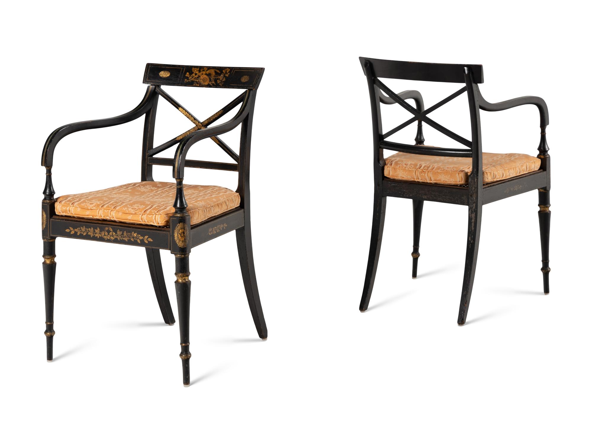 A Set of Twelve Regency Ebonized and Parcel Gilt Dining Chairs