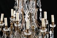 A Louis XV Style Bronze and Glass Twelve-Light Chandelier