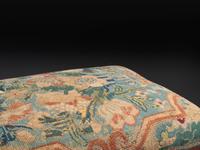 An American Empire Mahogany Veneered and Needlepoint Upholstered Footstool