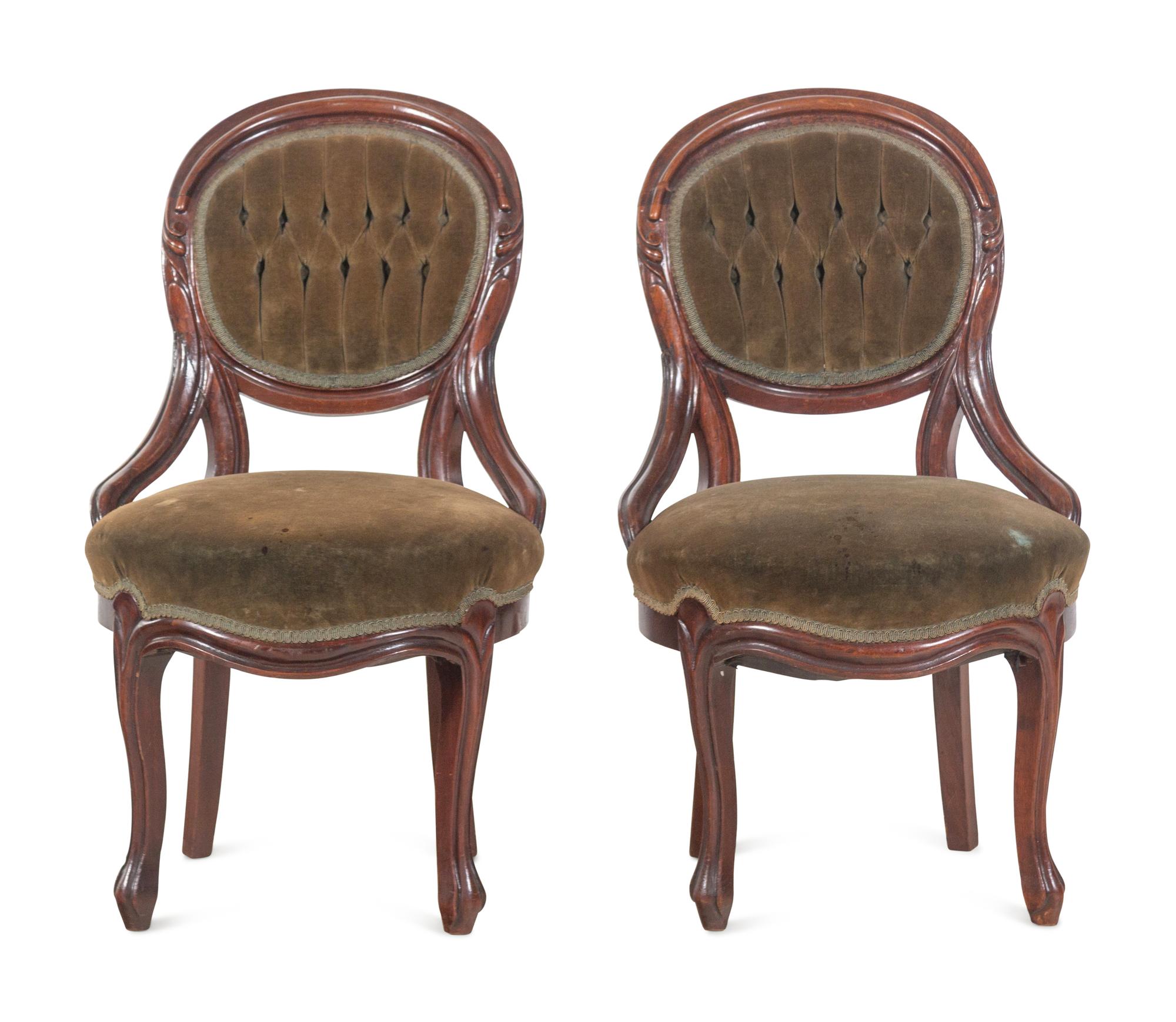 A Pair of Victorian Rococo Revival Walnut Side Chairs and a Victorian Side Table