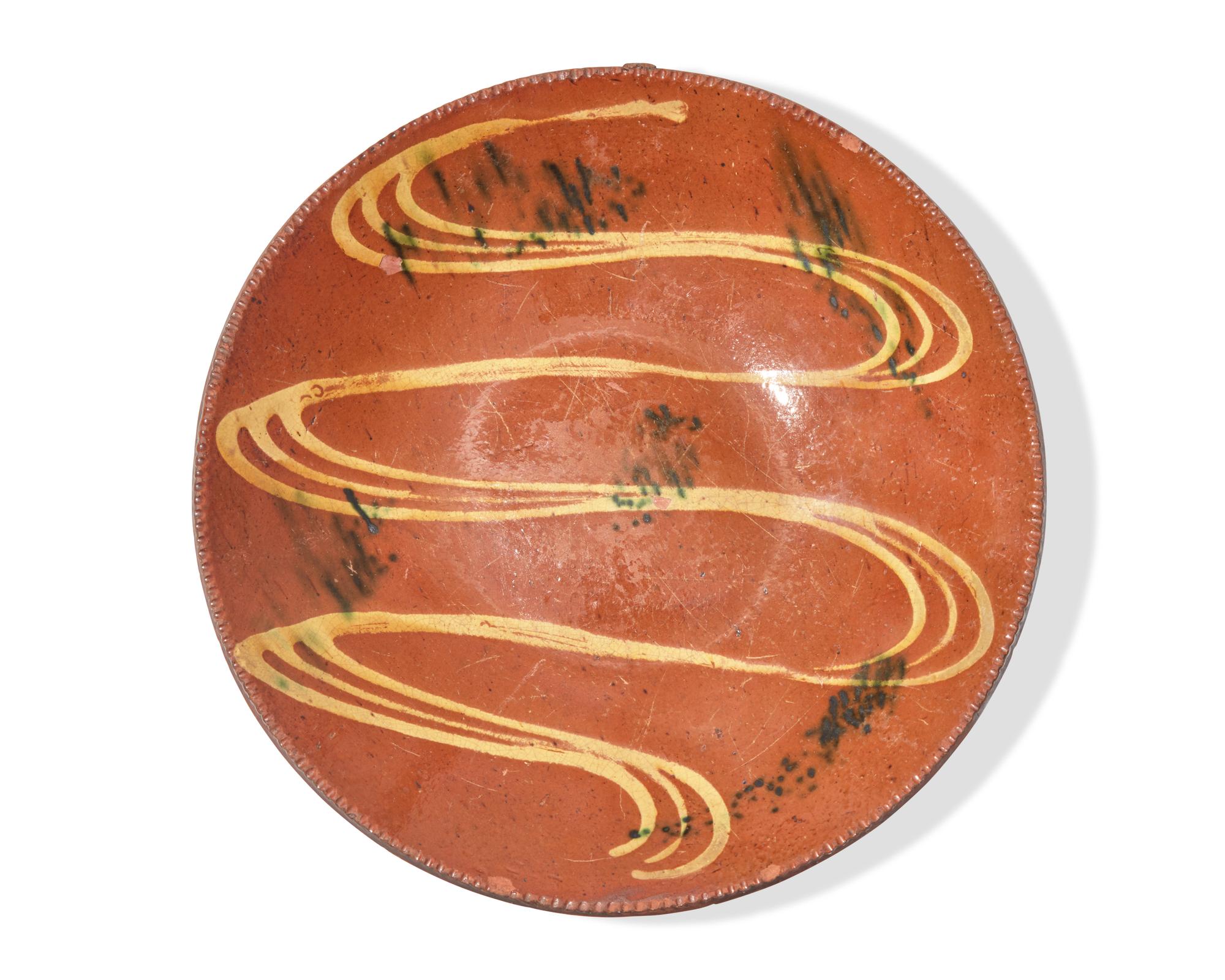 A Glazed and Slip-Decorated Redware Charger, Southeastern Pennsylvania, 19th Century