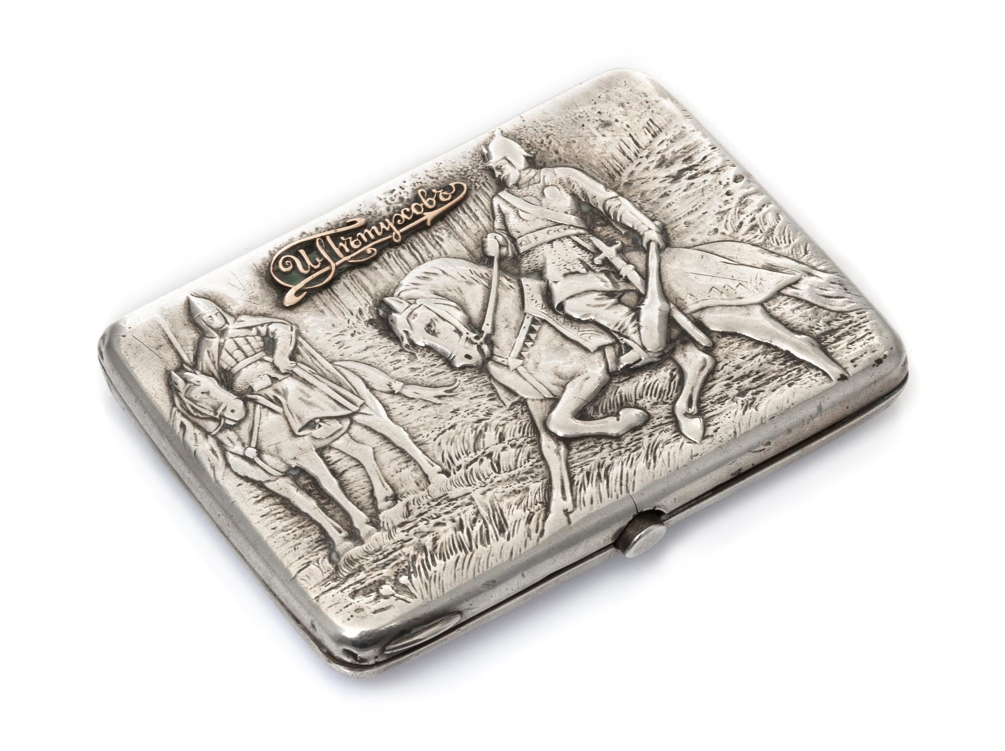 A Russian Silver Cigarette Case, Mark of Pytor Petrov, Moscow, early 20th century, the lid worked to show two warriors on horseback wit