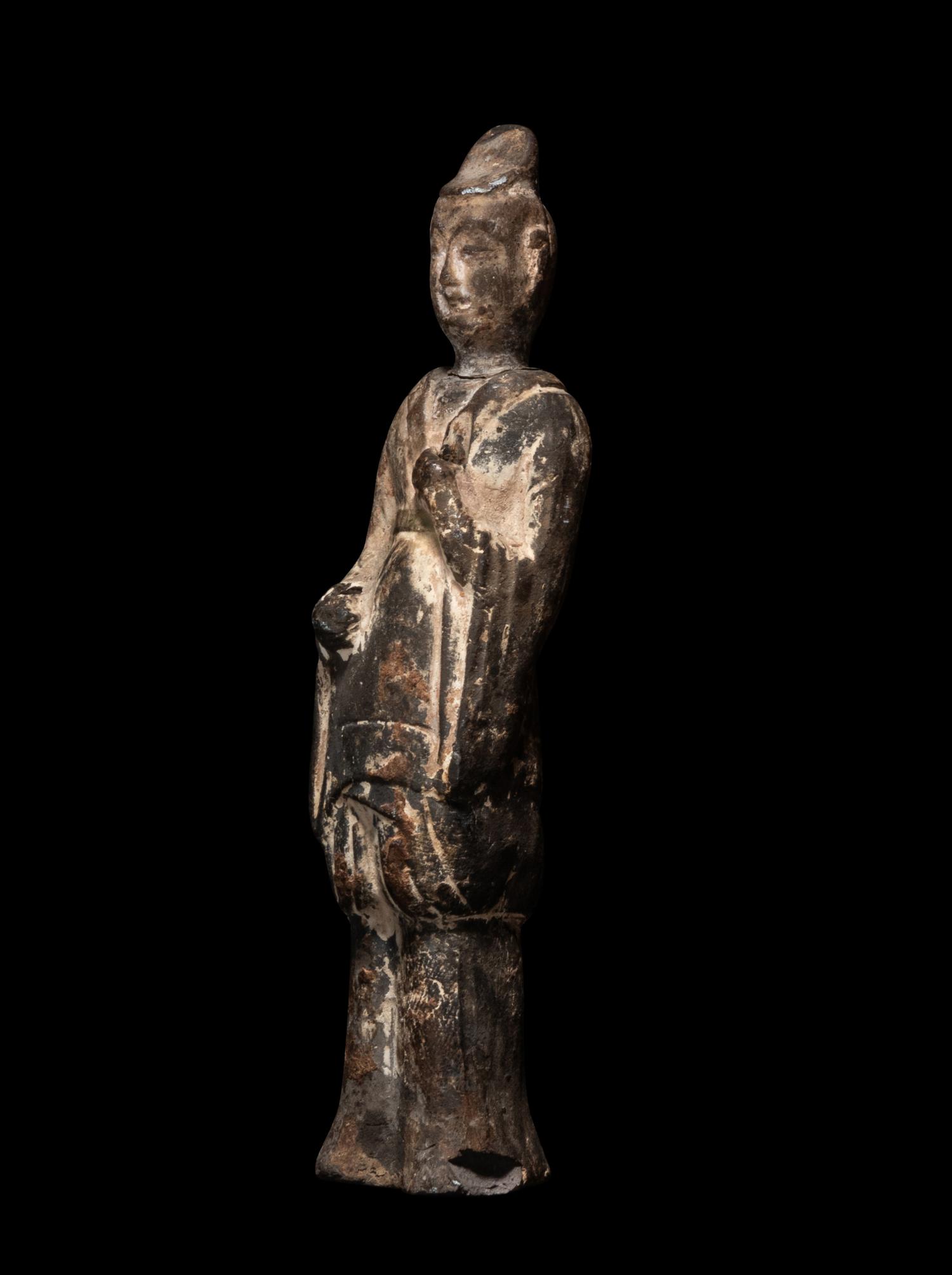 A Chinese Pottery Figure of a Standing Scholar