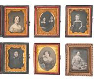 [EARLY PHOTOGRAPHY]. 17 ninth plate daguerreotypes of female subjects and 3 ninth plate ambrotypes.