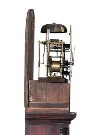A Chippendale Inlaid and Figured Mahogany Tall Case Clock