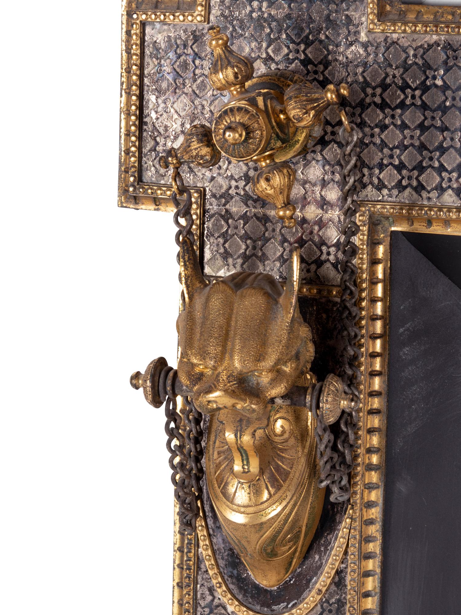 A Continental Silvered and Gilt Bronze Fireplace Surround