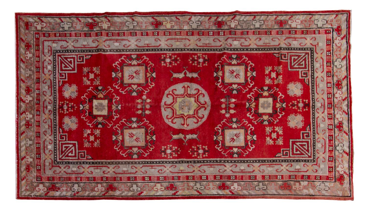 A Khotan Wool Rug, 7 feet 5 inches x 4 feet 4 inches.