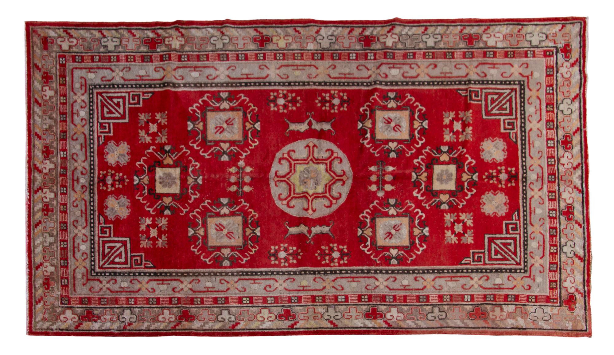 A Khotan Wool Rug, 7 feet 5 inches x 4 feet 4 inches.