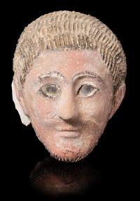 A Romano-Egyptian Plaster Mummy Mask Height 9 1/2 inches. — CIRCA 2ND CENTURY C.E.