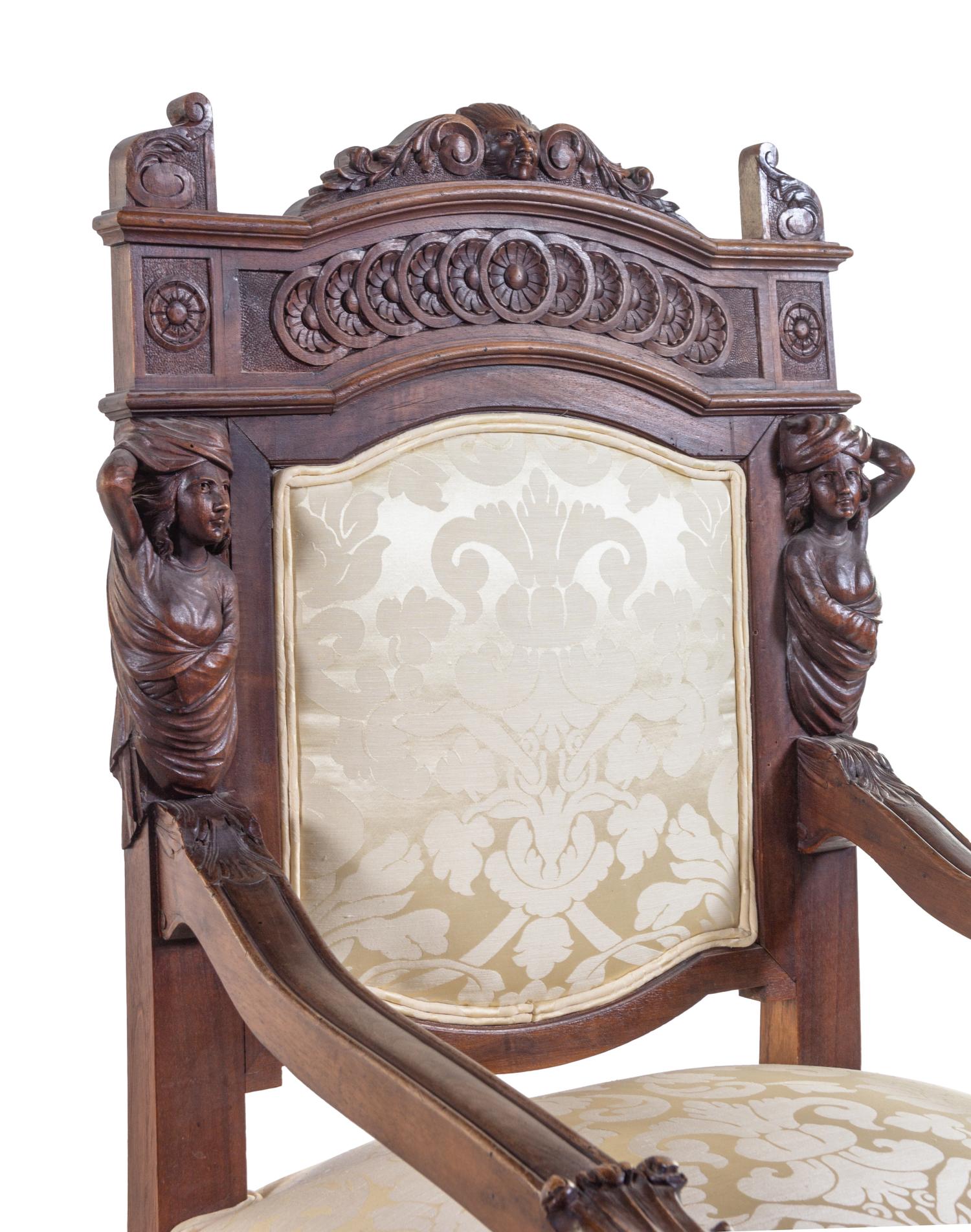 A Pair of French Renaissance Revival Carved Walnut Armchairs