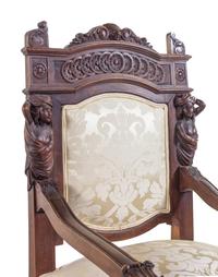 A Pair of French Renaissance Revival Carved Walnut Armchairs