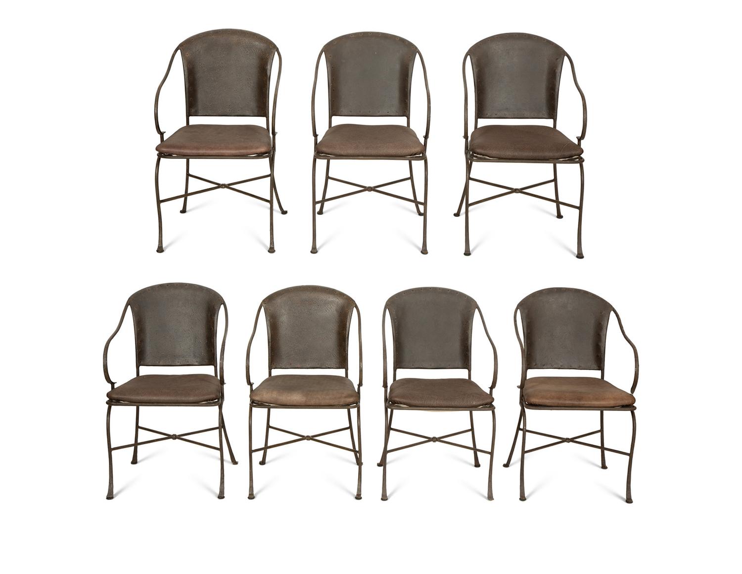 A Set of Seven Patinated Metal Dining Chairs