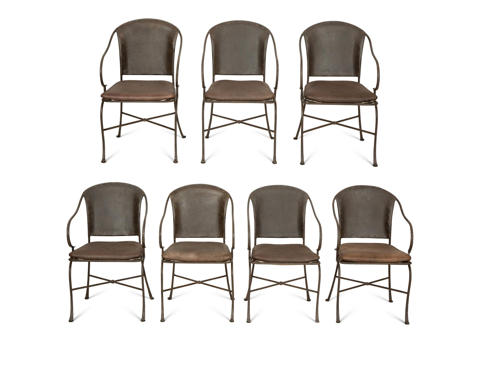 A Set of Seven Patinated Metal Dining Chairs