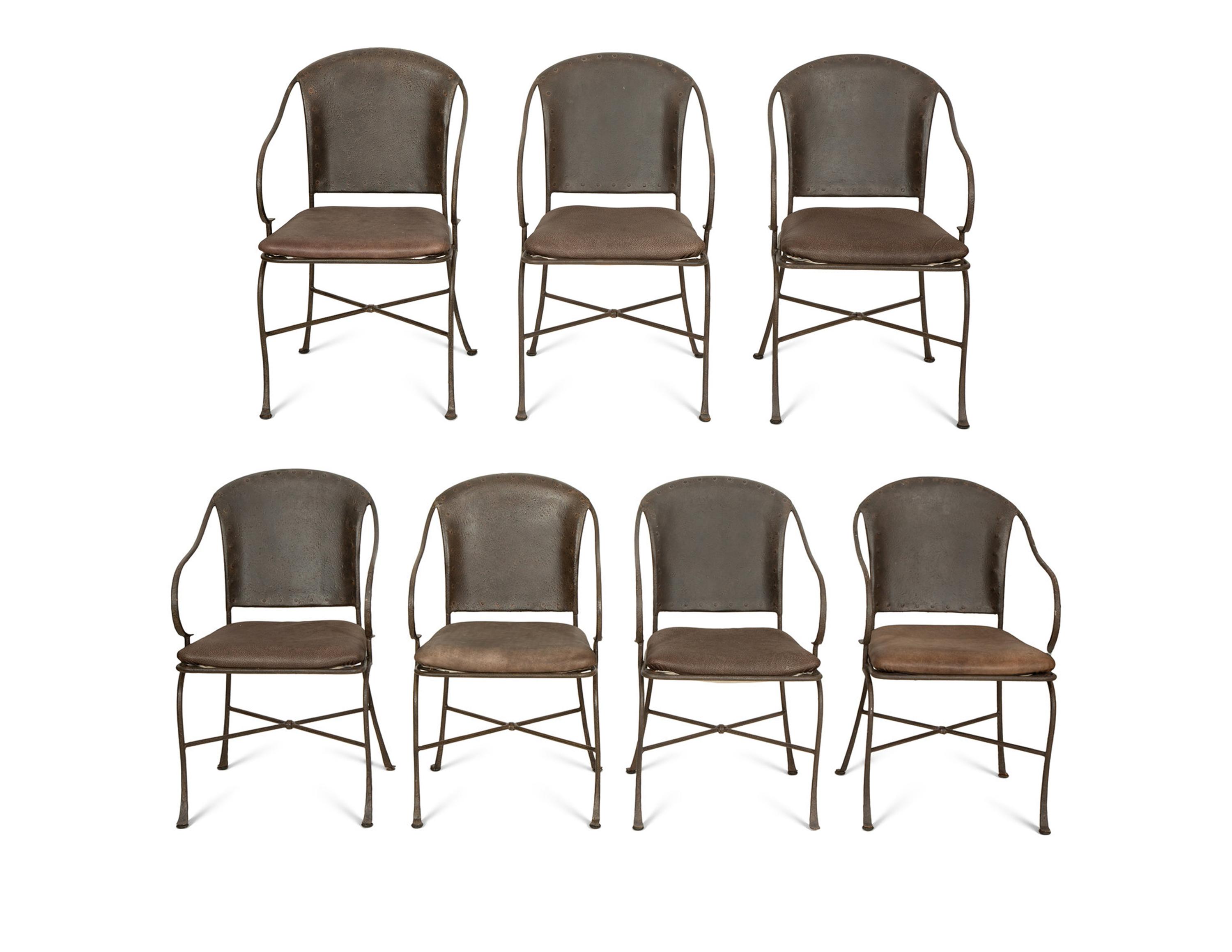 A Set of Seven Patinated Metal Dining Chairs
