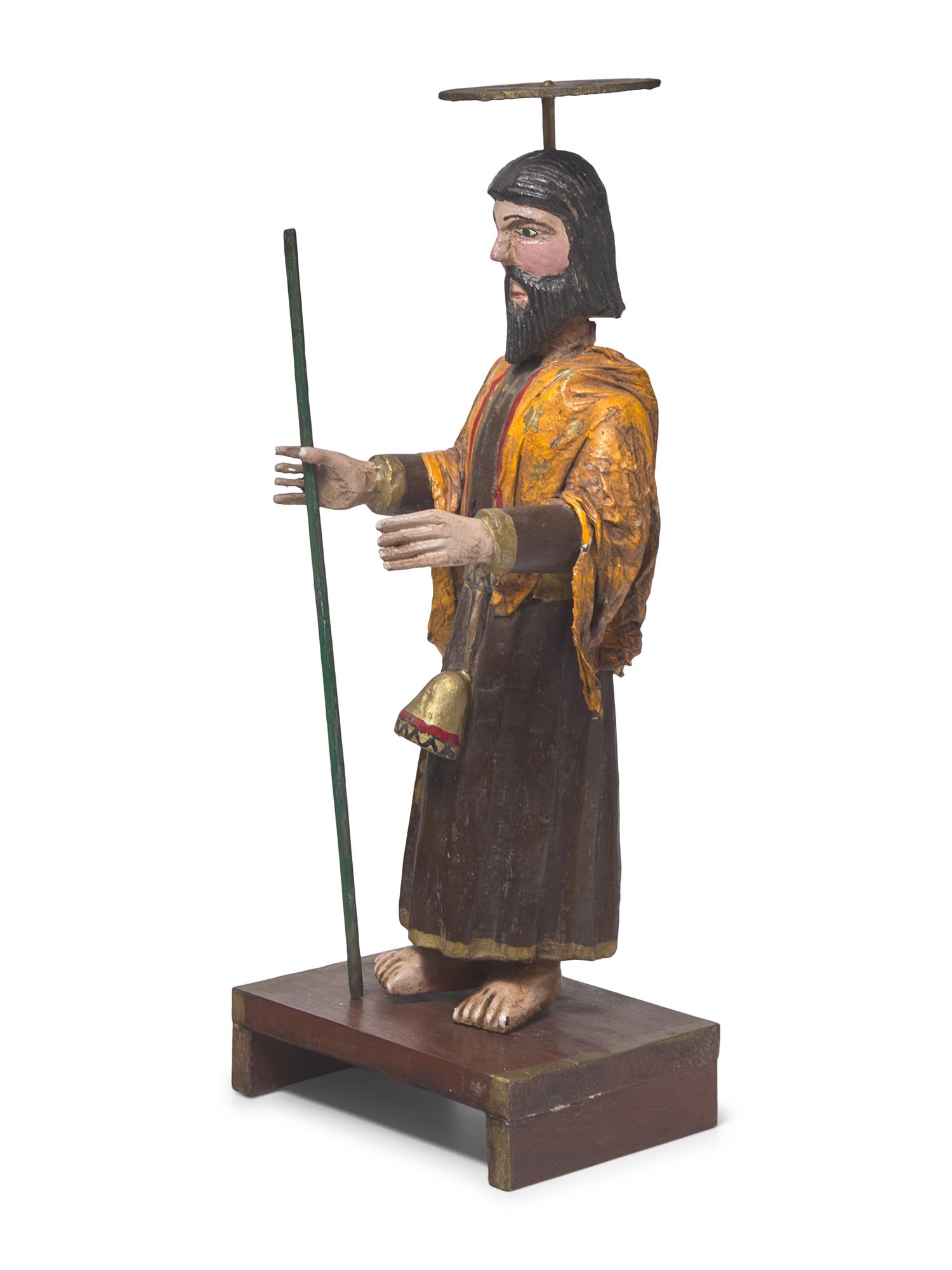 A Carved and Painted Wood and Plaster Santos Figure