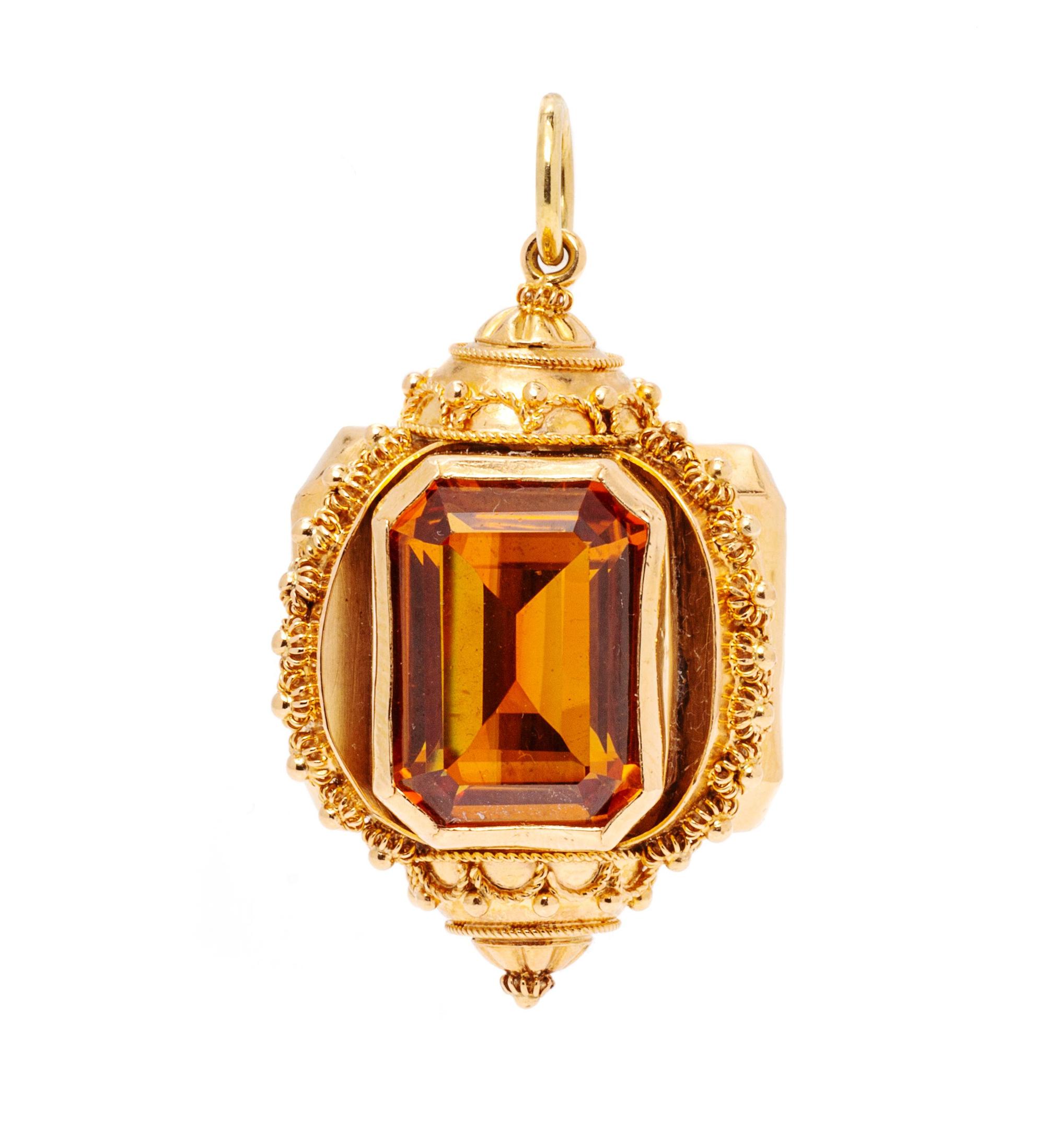 A Rose Gold and Synthetic Orange Sapphire Charm,