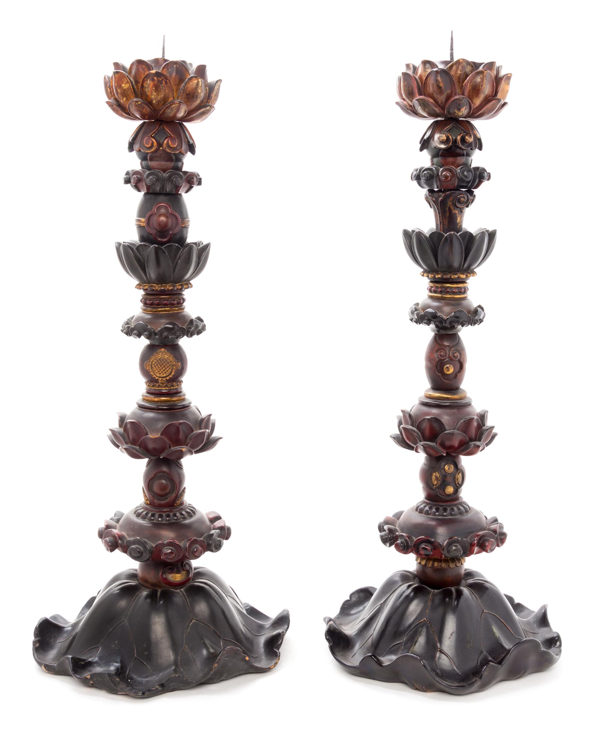 A Pair of Zelkova Wood Candlesticks Height of each 25 1/2 inches.