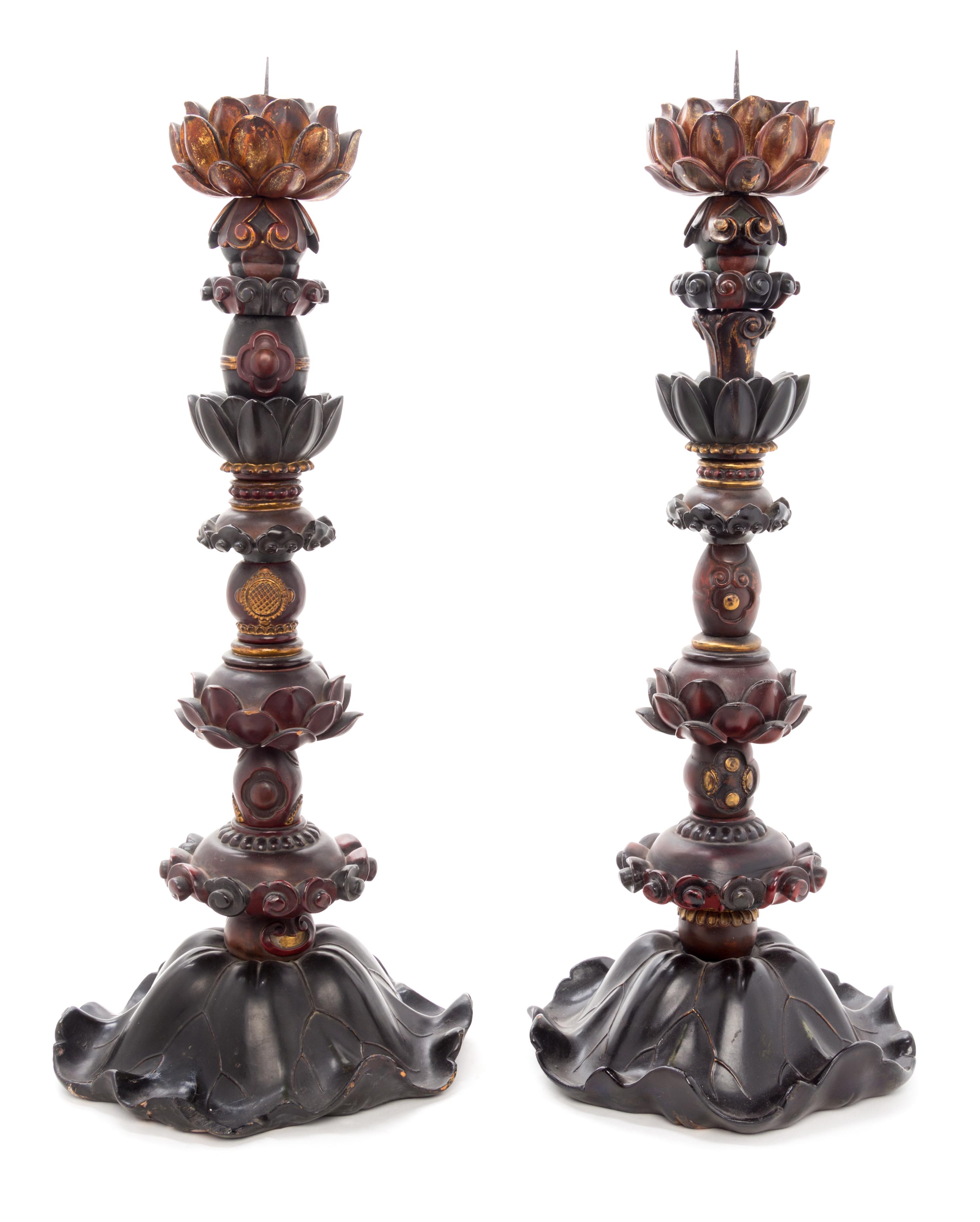 A Pair of Zelkova Wood Candlesticks Height of each 25 1/2 inches.