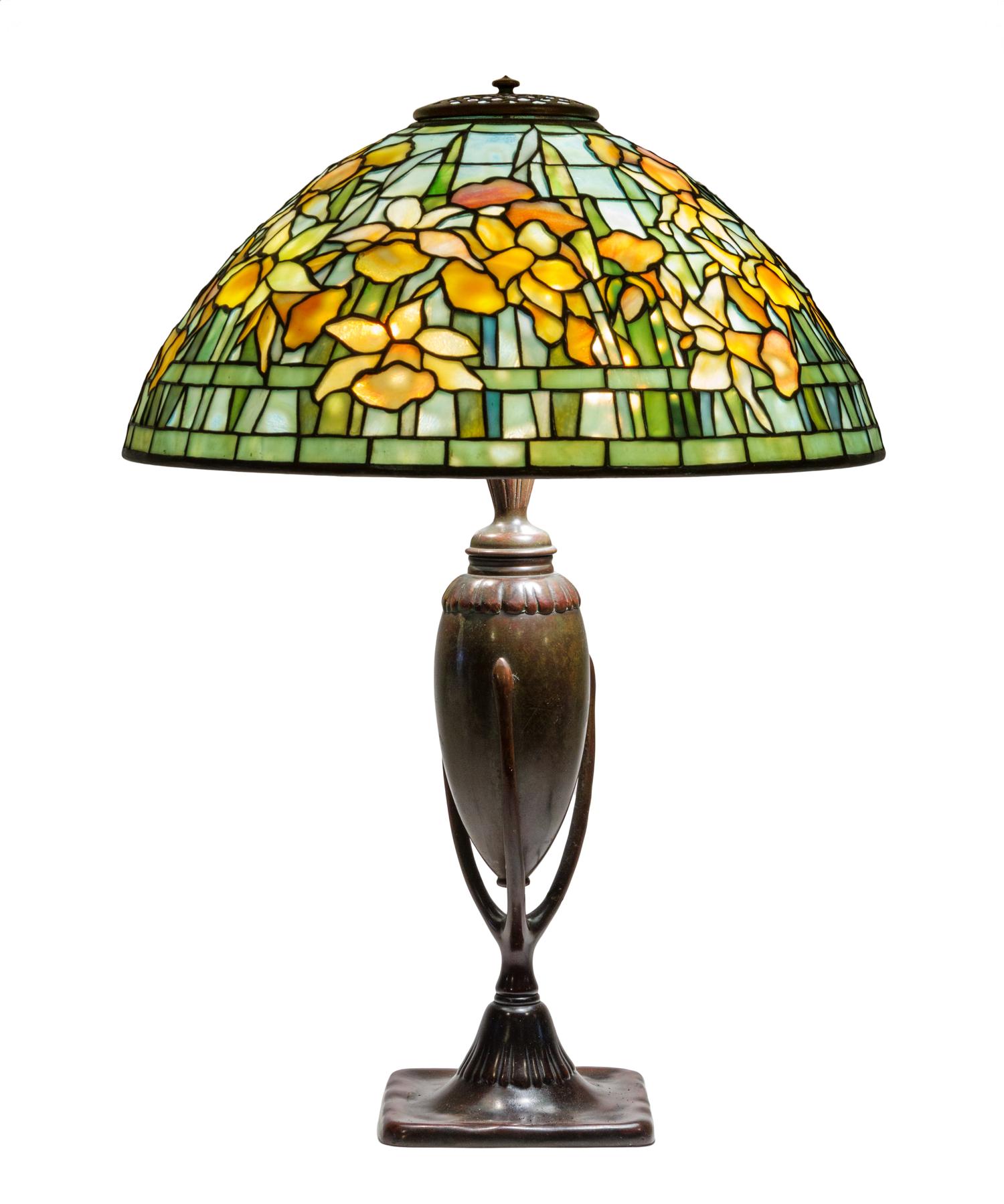 A Tiffany Studios Favrile Glass and Bronze Daffodil Table Lamp Diameter of shade 15 1/4 inches; height overall 21 1/2 inches.