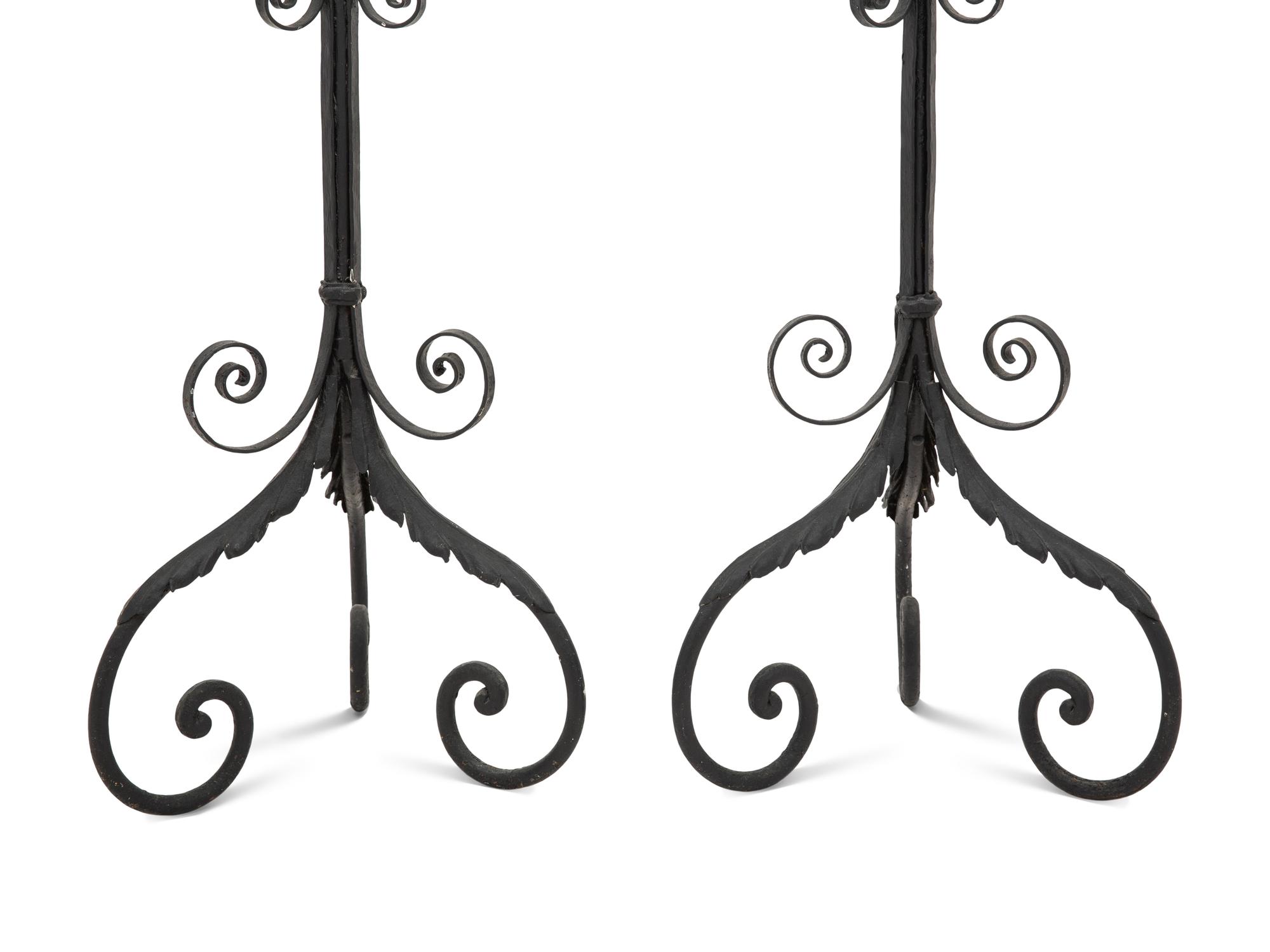 A Pair of Spanish Colonial Style Wrought Iron Floor Lanterns