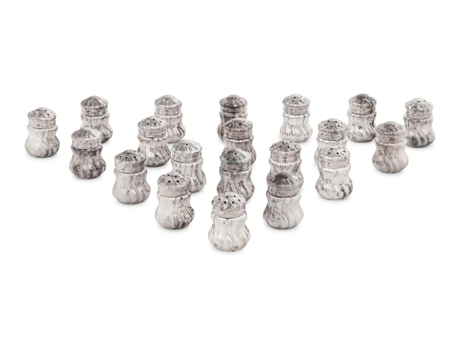 A Set of Twenty Silver Shakers