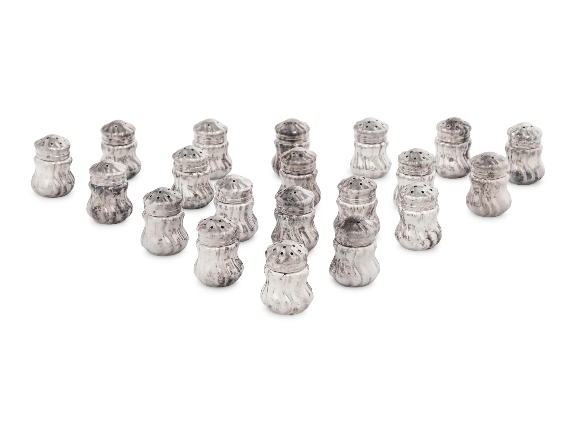 A Set of Twenty Silver Shakers