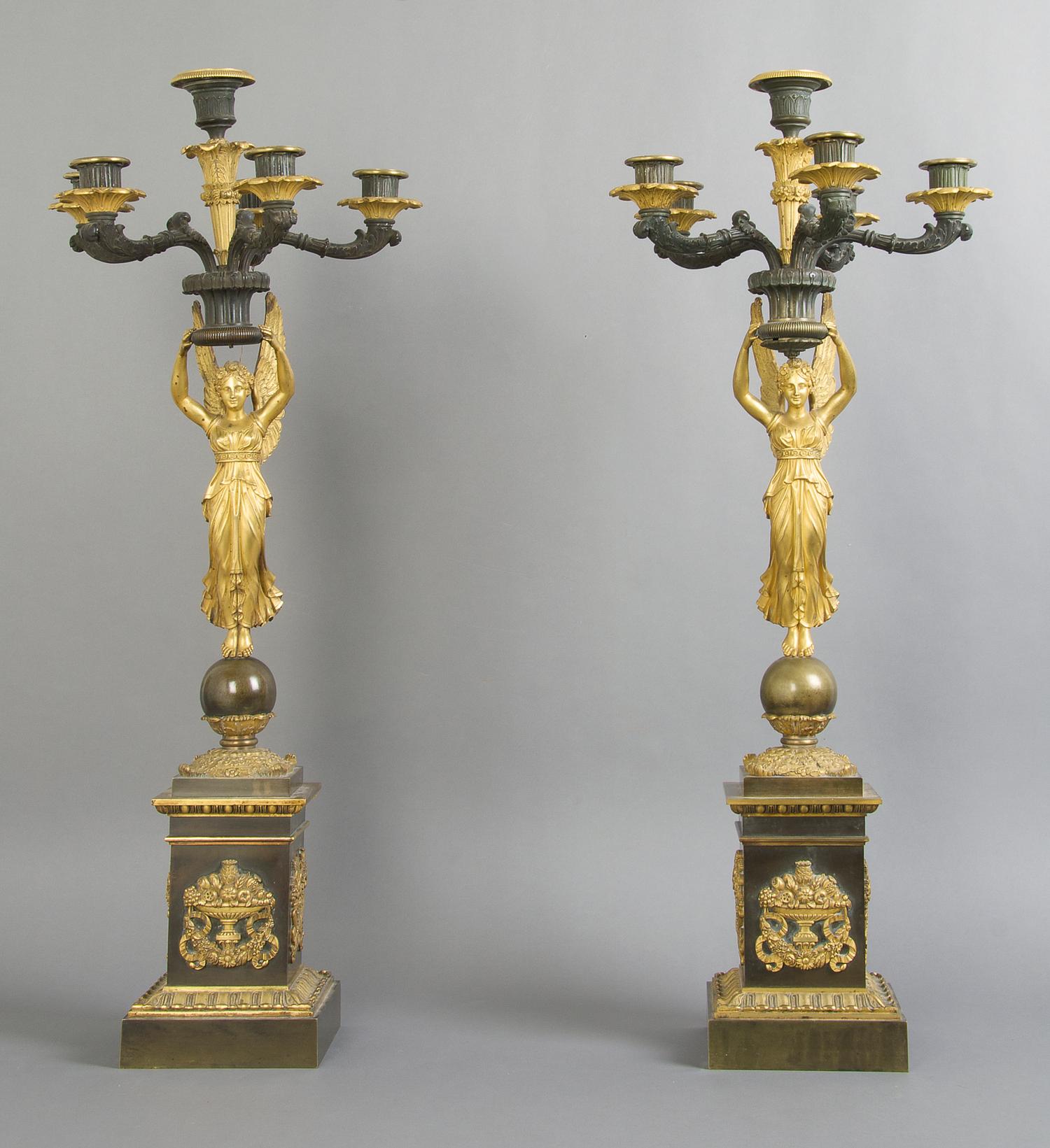 A Pair of Empire Gilt and Patinated Bronze Six-Light Candelabra, Height 29 inches.