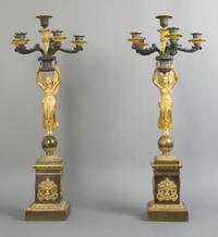 A Pair of Empire Gilt and Patinated Bronze Six-Light Candelabra, Height 29 inches.