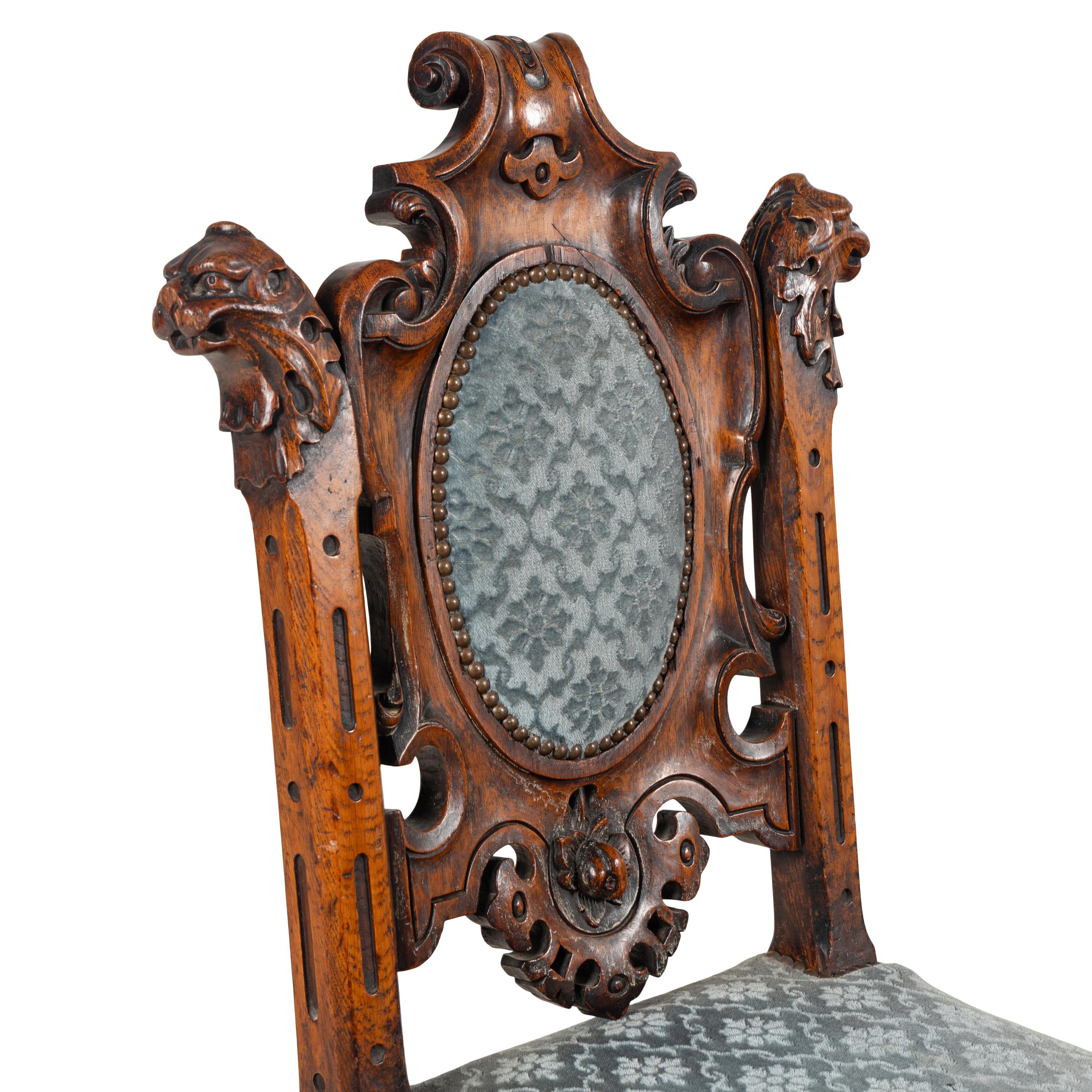 A Set of Six French Carved Oak Dining Chairs