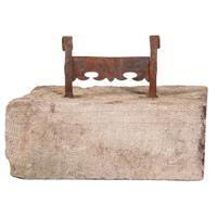 A Wrought Iron Boot Scrape with Limestone Base