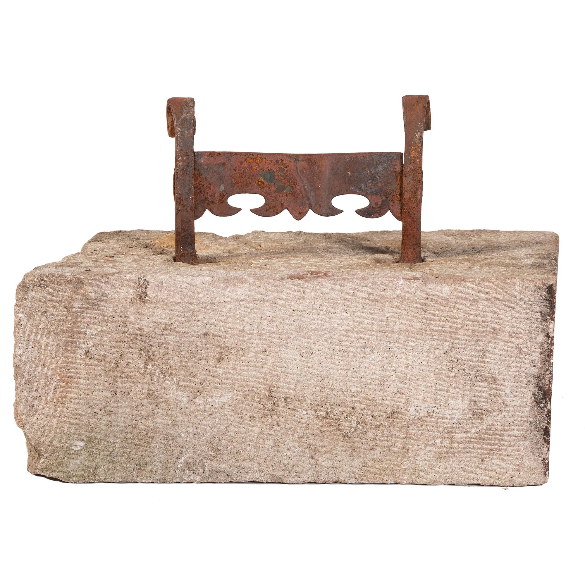 A Wrought Iron Boot Scrape with Limestone Base
