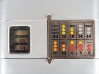 A Mills Novelty Co. 5 Cent Miniature Three Reel Slot Machine