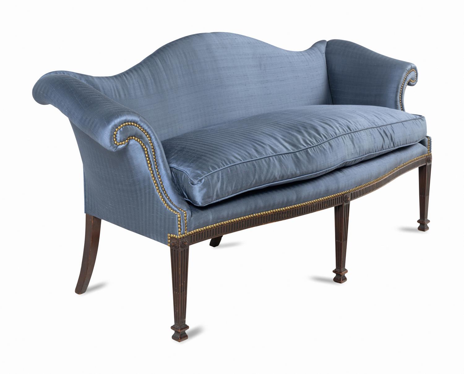 A George III Style Carved Mahogany Camelback Sofa