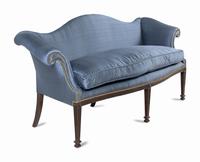 A George III Style Carved Mahogany Camelback Sofa