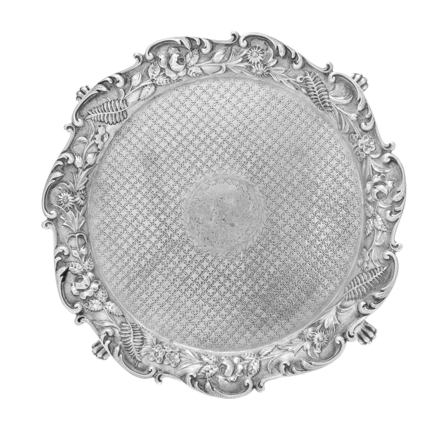 An American Silver Salver, S. Kirk & Son, Baltimore, MD, the rim formed of S-scrolls enclosing the repousse floral and foliate border,